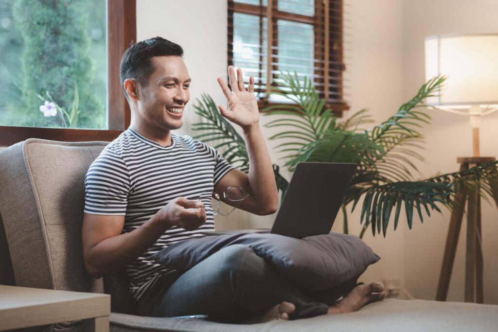 Man participating in an online video therapy session from home, representing convenient anxiety therapy online.